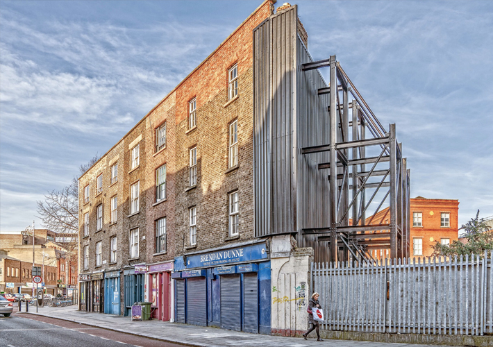 A terrace of buildings at the northern end of Capel Street. Number 78-84, built in 1822, comprise a terrace of single-bay Georgian houses with Wyatt windows to the upper floors and Doric shopfronts to the ground floor. The terrace end is clad in corrugated steel and a framework of steel I beams. Photo: William Murphy, CC licence https://www.flickr.com/photos/infomatique/33670056095/in/photostream/