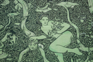A close-up of an artwork detail on the Project billboard. The artwork is a green and black drawing of water overflowing from Holy Wells. A surprised figure is surrounded by dense foliage. Fish and strange creatures are appearing from the water. In the upper left is a cap which reads "Kiss Me I'm Irish."