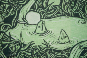 A close-up of an artwork detail on the right edge of the Project billboard. The artwork is a green and black drawing of water overflowing from Holy Wells. Here, two fish emerge from a pool surrounded by dense folliage.